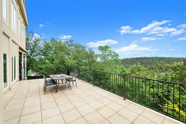 5801 Cannonade Ct, Austin, TX 78746 - view of patio / terrace with outdoor dining space and a wooded view