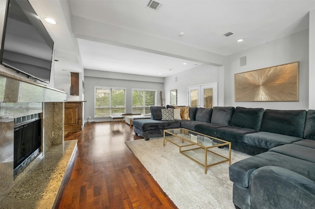 5801 Cannonade Ct, Austin, TX 78746 - living room with dark wood-style flooring, a fireplace, and recessed lighting