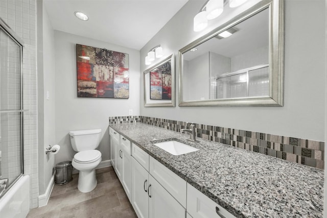 5801 Cannonade Ct, Austin, TX 78746 - full bathroom featuring vanity, tile patterned flooring, and bath / shower combo with glass door