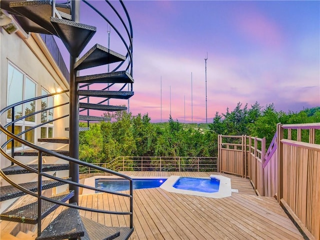 5801 Cannonade Ct, Austin, TX 78746 - pool at dusk featuring a wooden deck and stairway