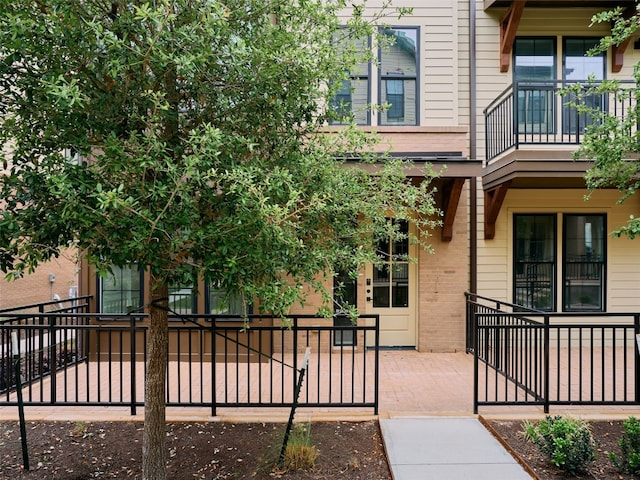 2209 Woodland Ave Unit 501, Austin, TX 78741 - entrance to property with fence and brick siding