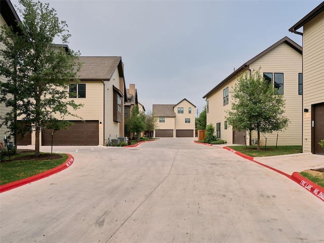 2209 Woodland Ave Unit 501, Austin, TX 78741 - view of concrete road featuring curbs and a residential view