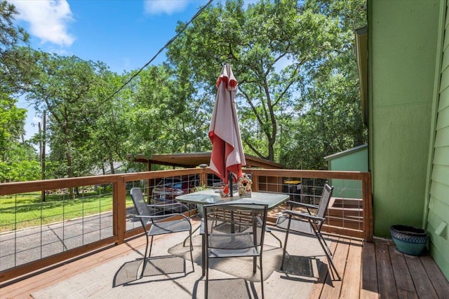 113 S Kanaio Dr, Bastrop, TX 78602 - wooden terrace featuring outdoor dining space