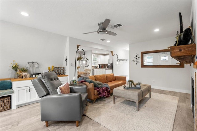 113 S Kanaio Dr, Bastrop, TX 78602 - living room with a ceiling fan, light wood finished floors, and recessed lighting