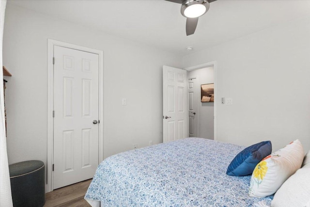 113 S Kanaio Dr, Bastrop, TX 78602 - bedroom featuring wood finished floors and ceiling fan