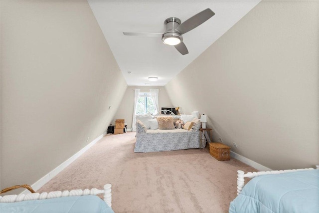 113 S Kanaio Dr, Bastrop, TX 78602 - bedroom with carpet floors, baseboards, vaulted ceiling, and ceiling fan