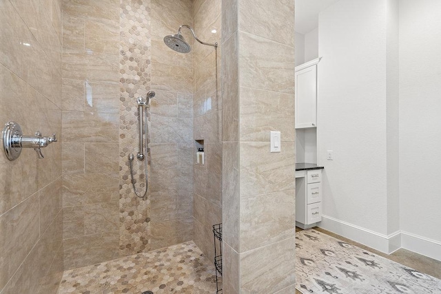 9750-9800 Ledgestone Ter, Austin, TX 78737 - bathroom with a tile shower and baseboards