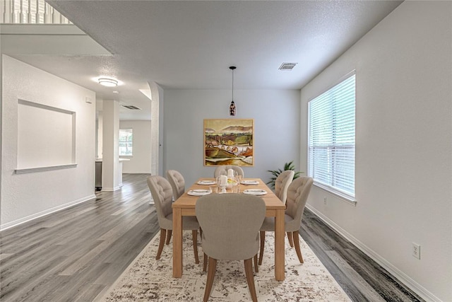 dining room with wood finished floors and baseboards
