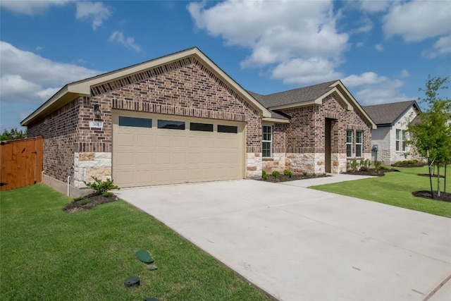 513 Tekoa Dr, Georgetown, TX 78628 - french provincial home with stone siding, an attached garage, driveway, and brick siding