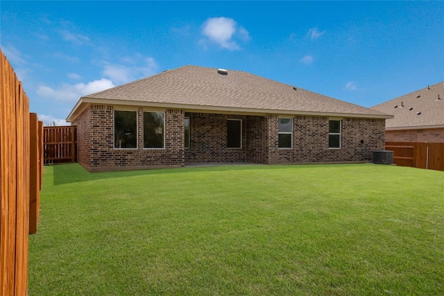 513 Tekoa Dr, Georgetown, TX 78628 - back of property featuring brick siding, a shingled roof, and cooling unit