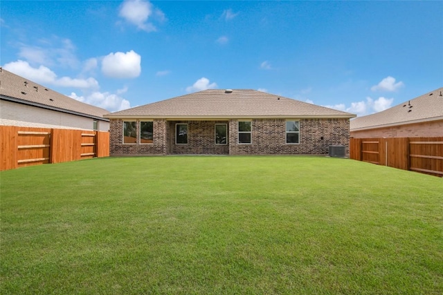 513 Tekoa Dr, Georgetown, TX 78628 - rear view of property with central AC unit and brick siding