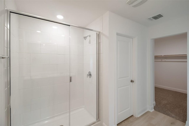 513 Tekoa Dr, Georgetown, TX 78628 - full bath featuring a shower stall, a walk in closet, and baseboards