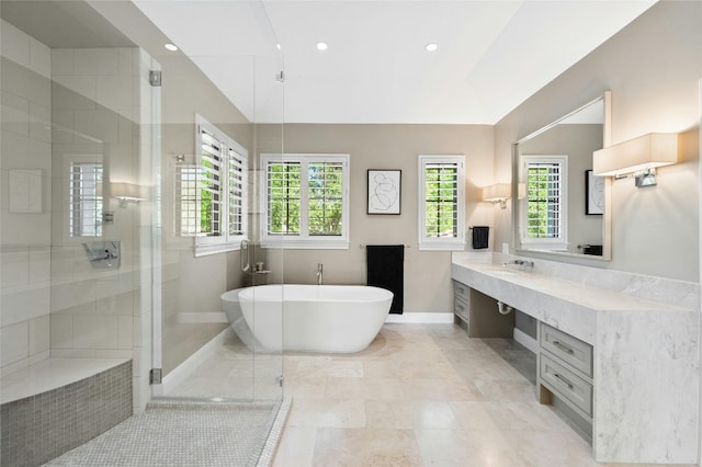 3205 Rustic River Cv, Austin, TX 78746 - bathroom with a freestanding bath, vanity, a stall shower, healthy amount of natural light, and recessed lighting