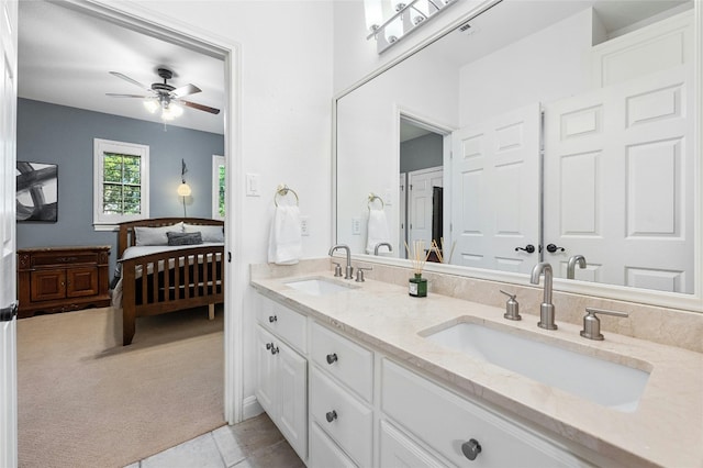 bathroom featuring ceiling fan, tile patterned flooring, and double vanity