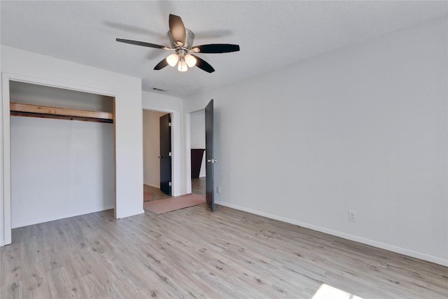 4504 Little Hill Cir, Austin, TX 78725 - unfurnished bedroom with light wood-type flooring, a closet, ceiling fan, and baseboards