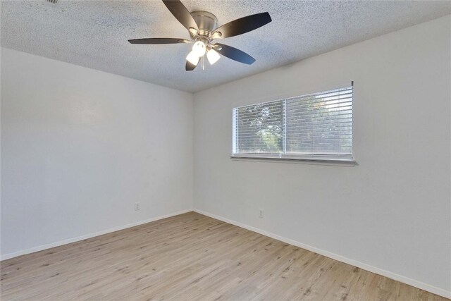 4504 Little Hill Cir, Austin, TX 78725 - empty room featuring wood finished floors, baseboards, a textured ceiling, and a ceiling fan