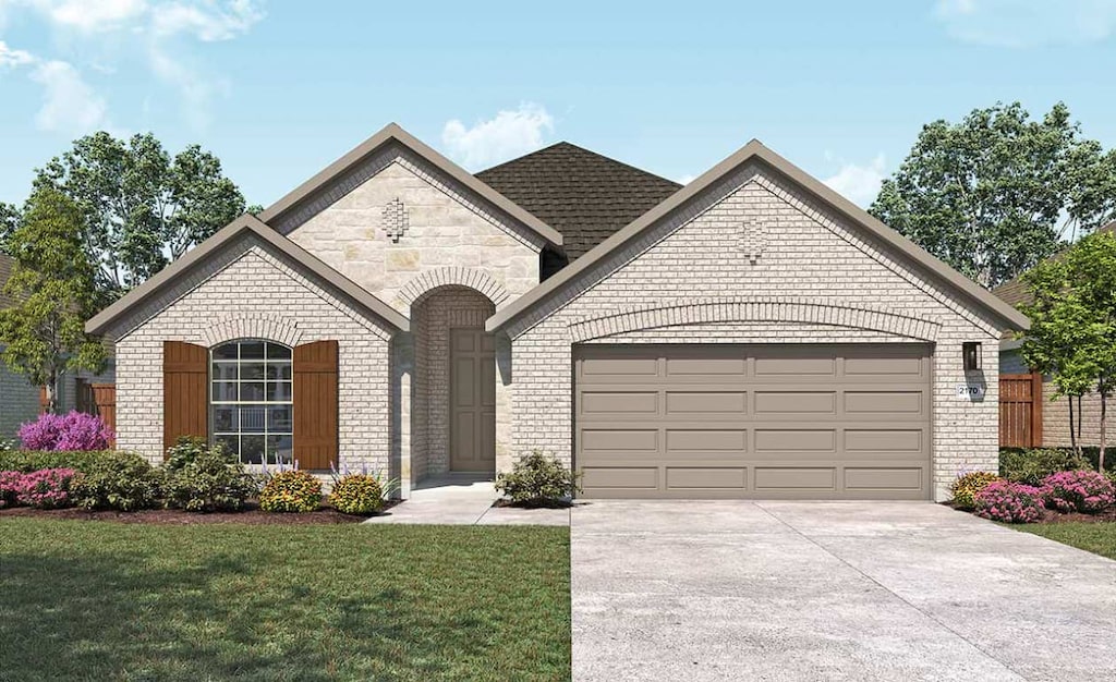538 Tubman Dr, Kyle, TX 78640 - french provincial home featuring brick siding, a garage, driveway, and a front lawn