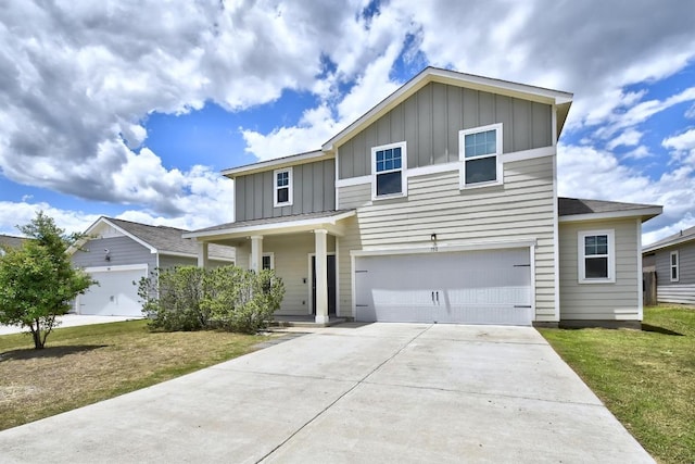 750 Bunton Reserve Blvd, Kyle, TX 78640 - traditional-style home featuring board and batten siding, concrete driveway, an attached garage, a front yard, and a porch