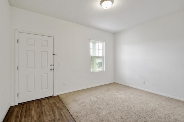 750 Bunton Reserve Blvd, Kyle, TX 78640 - spare room featuring baseboards and wood finished floors