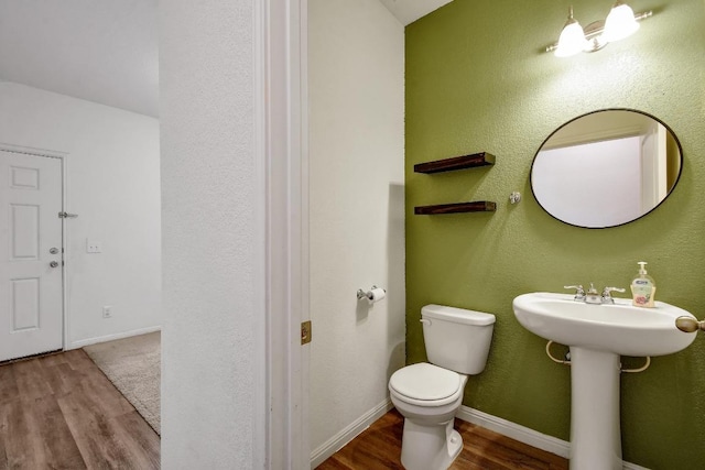 750 Bunton Reserve Blvd, Kyle, TX 78640 - bathroom with wood finished floors and a textured wall