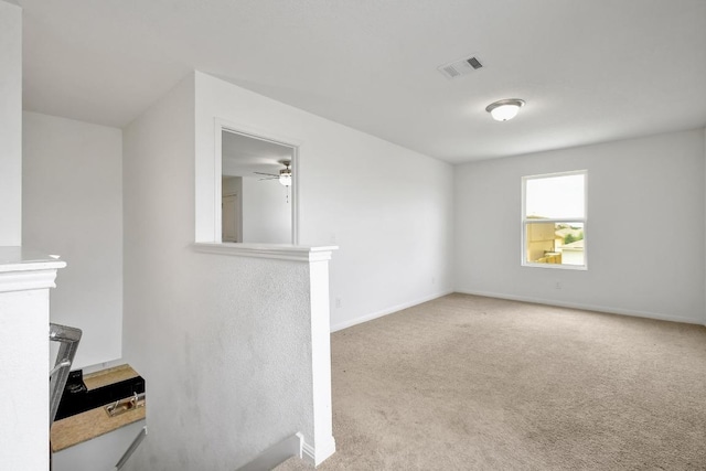 750 Bunton Reserve Blvd, Kyle, TX 78640 - unfurnished living room featuring carpet and a ceiling fan