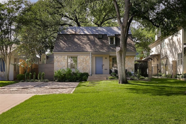 dutch colonial with stone siding and a gate