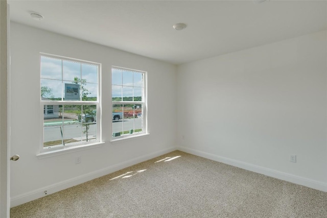 537 Tekoa Dr, Georgetown, TX 78628 - empty room featuring carpet flooring, baseboards, and a smoke detector