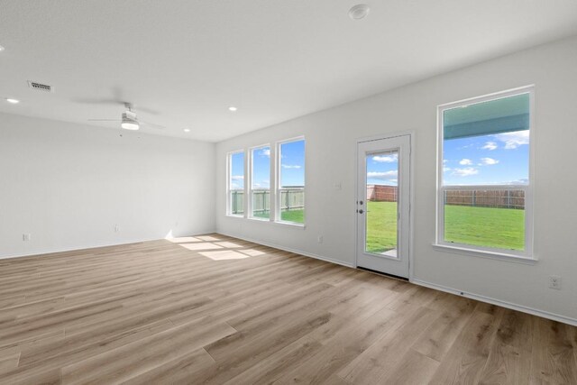 3759 Liberi Ln, Round Rock, TX 78665 - unfurnished room with light wood finished floors, a ceiling fan, baseboards, and recessed lighting