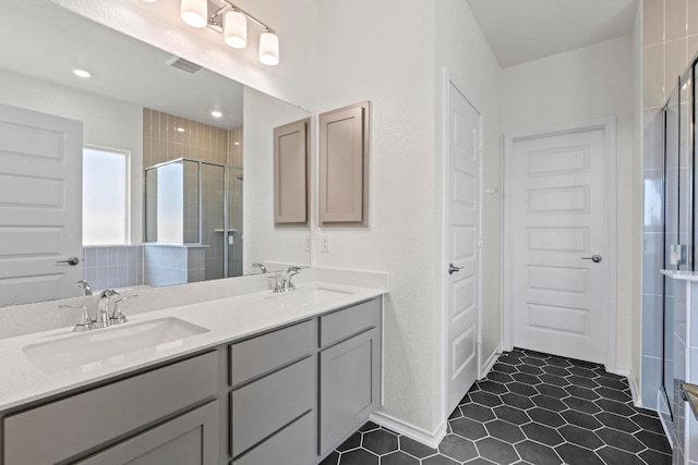 3759 Liberi Ln, Round Rock, TX 78665 - bathroom featuring a stall shower, double vanity, and tile patterned floors