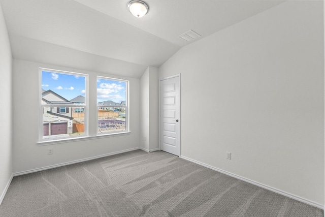 3759 Liberi Ln, Round Rock, TX 78665 - carpeted empty room featuring vaulted ceiling and baseboards