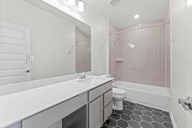 3759 Liberi Ln, Round Rock, TX 78665 - full bathroom with toilet, tile patterned flooring, washtub / shower combination, vanity, and recessed lighting
