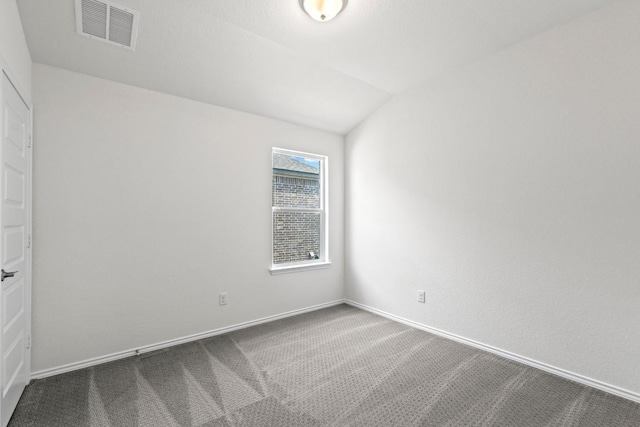 3759 Liberi Ln, Round Rock, TX 78665 - spare room with dark colored carpet, vaulted ceiling, and baseboards