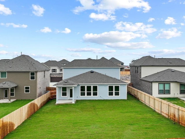 3759 Liberi Ln, Round Rock, TX 78665 - rear view of property featuring a residential view, a shingled roof, and a patio area