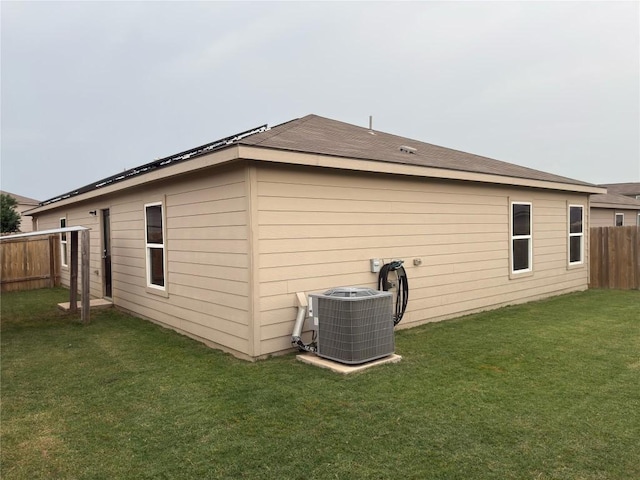 721 Yearwood Ln Unit 45E, Jarrell, TX 76537 - rear view of house with central AC unit