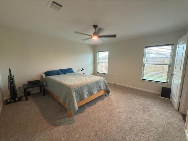 721 Yearwood Ln Unit 45E, Jarrell, TX 76537 - carpeted bedroom featuring baseboards and ceiling fan
