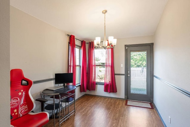 404 Paige Bnd, Hutto, TX 78634 - dining room with a chandelier and wood finished floors