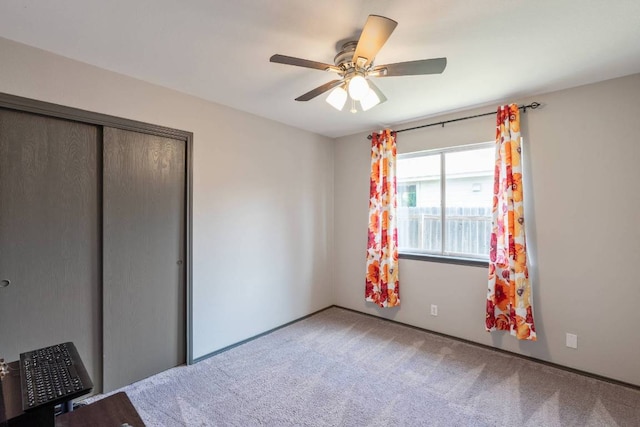 404 Paige Bnd, Hutto, TX 78634 - unfurnished bedroom featuring carpet, a closet, and ceiling fan