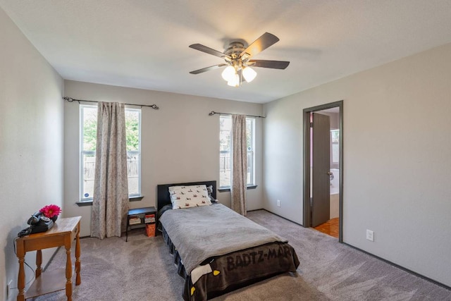 404 Paige Bnd, Hutto, TX 78634 - bedroom with light carpet and ceiling fan