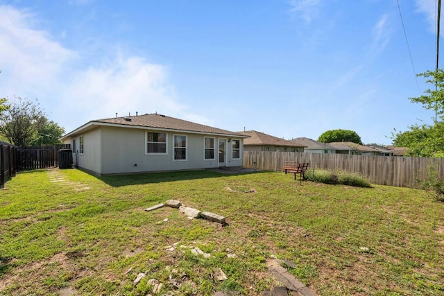 404 Paige Bnd, Hutto, TX 78634 - back of property featuring a fenced backyard