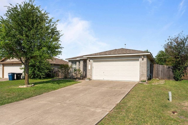 404 Paige Bnd, Hutto, TX 78634 - ranch-style home with brick siding, a garage, and concrete driveway