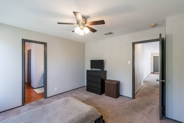 404 Paige Bnd, Hutto, TX 78634 - bedroom featuring light colored carpet and a ceiling fan
