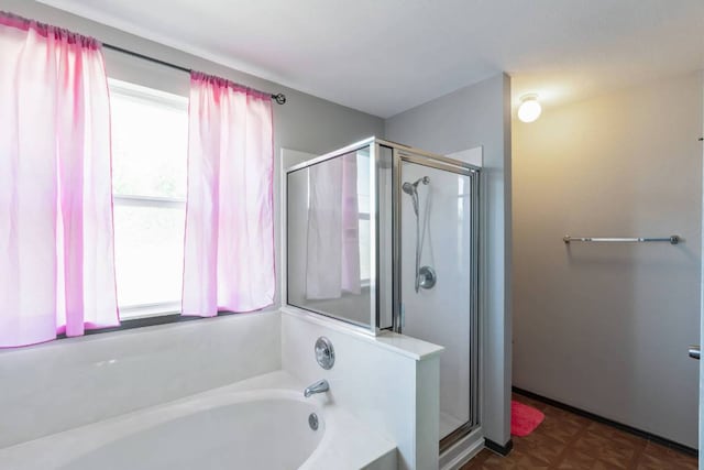404 Paige Bnd, Hutto, TX 78634 - full bathroom featuring a shower stall and a bath