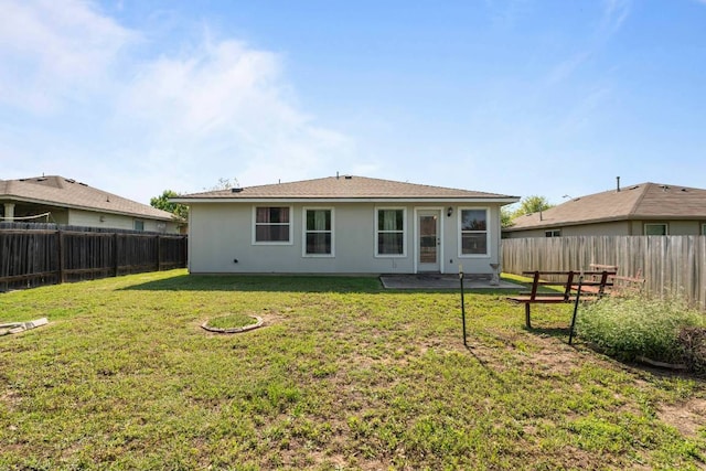 404 Paige Bnd, Hutto, TX 78634 - rear view of property featuring a fenced backyard and a patio area
