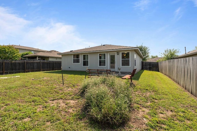 404 Paige Bnd, Hutto, TX 78634 - rear view of property featuring a fenced backyard and stucco siding