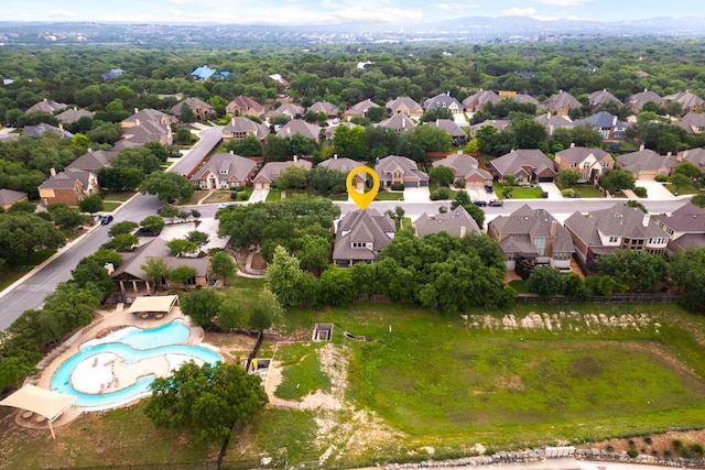 aerial view of residential area featuring a pool
