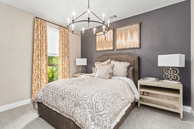 bedroom featuring a chandelier, carpet, and baseboards