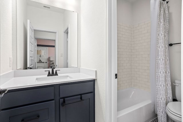 bathroom featuring toilet, vanity, and shower / bath combo with shower curtain