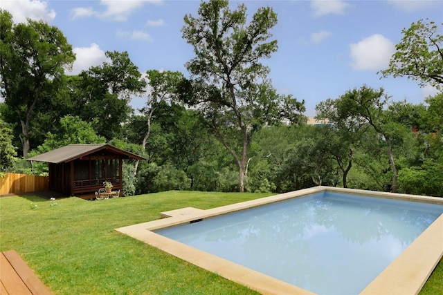 swimming pool featuring view of scattered trees