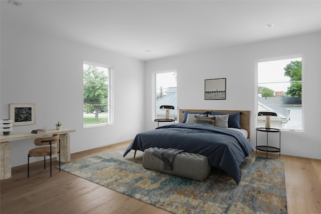 bedroom with wood finished floors