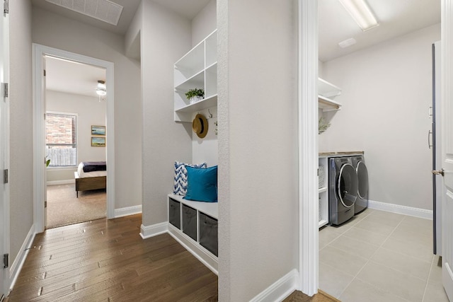 19312 Abigail Way, Pflugerville, TX 78660 - mudroom featuring washer and dryer, wood finished floors, and baseboards